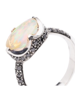 Ring with central opal and black diamonds